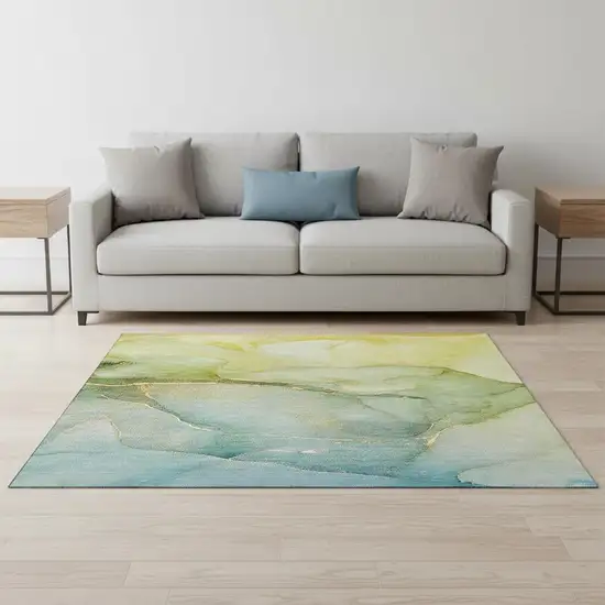 Green And Ivory Abstract Washable Area Rug With UV Protection Photo 1