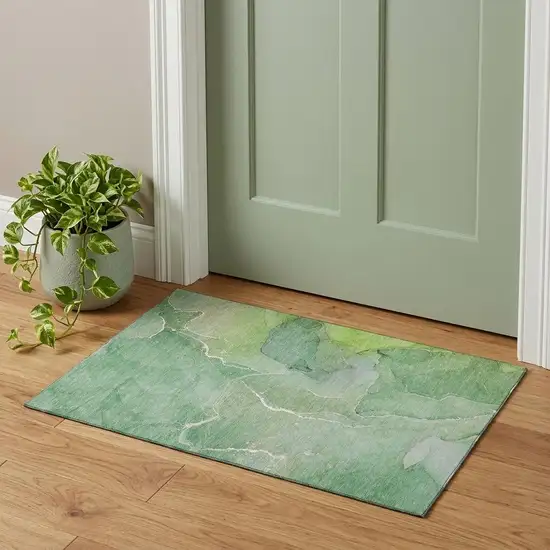 Green And Ivory Abstract Washable Area Rug With UV Protection Photo 1