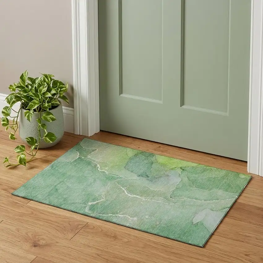 Green And Ivory Abstract Washable Area Rug With UV Protection Photo 1
