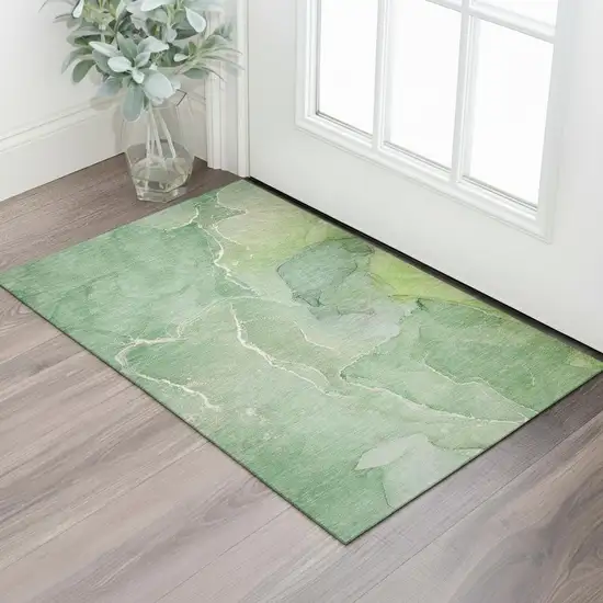 Green And Ivory Abstract Washable Area Rug With UV Protection Photo 1