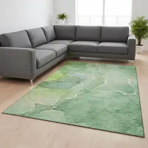 Photo of Green And Ivory Abstract Washable Area Rug With UV Protection