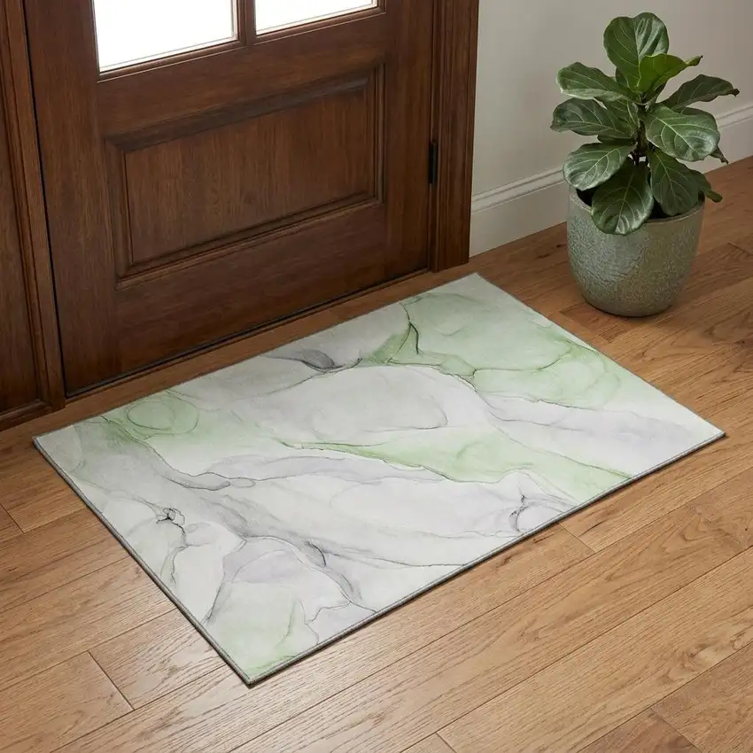 Green And Ivory Abstract Washable Area Rug With UV Protection Photo 1