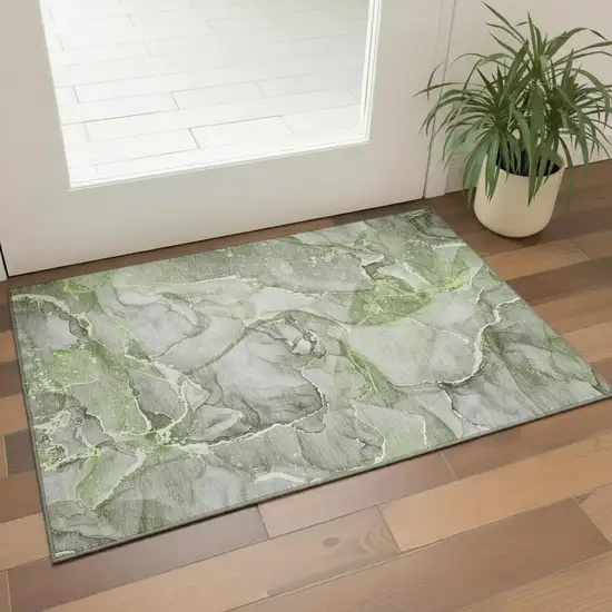 Green And Ivory Abstract Washable Area Rug With UV Protection Photo 1