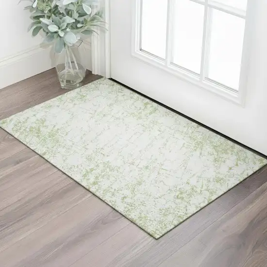 Green And Ivory Abstract Washable Area Rug With UV Protection Photo 1