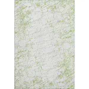 Photo of Green And Ivory Abstract Washable Area Rug With UV Protection