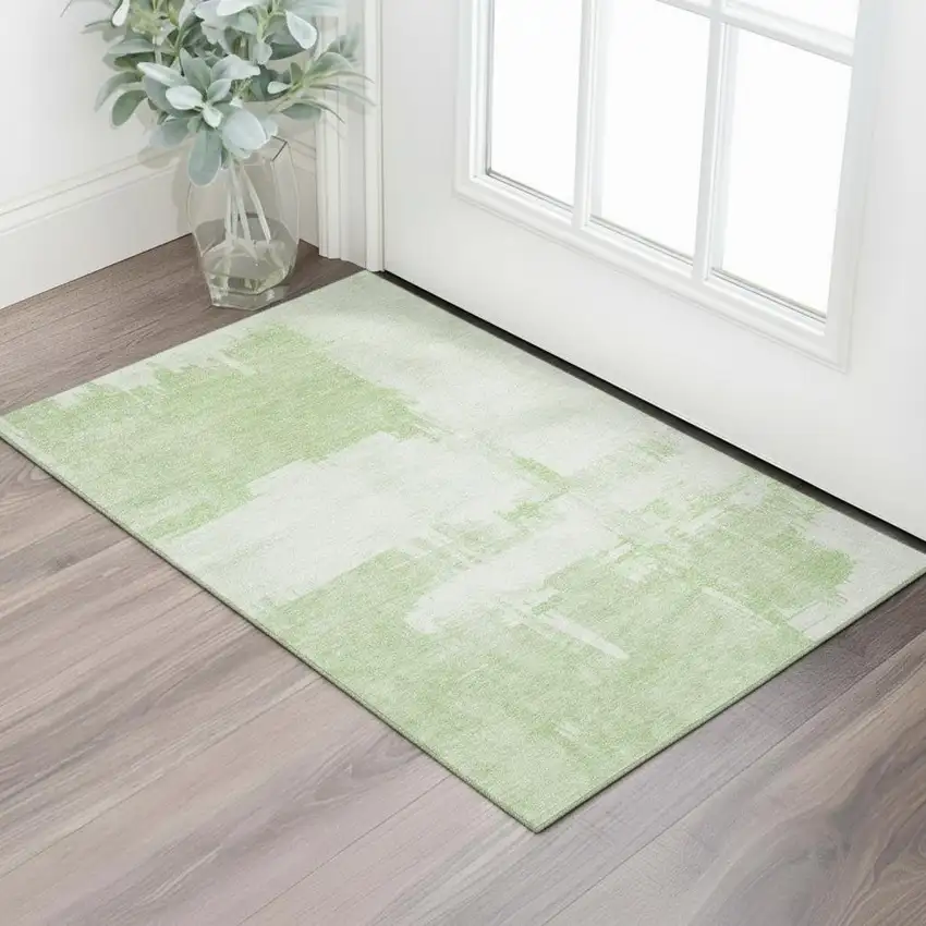 Green And Ivory Abstract Washable Area Rug With UV Protection Photo 1