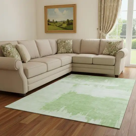 Green And Ivory Abstract Washable Area Rug With UV Protection Photo 1