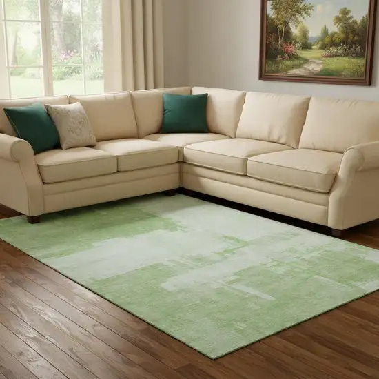 Green And Ivory Abstract Washable Area Rug With UV Protection Photo 1