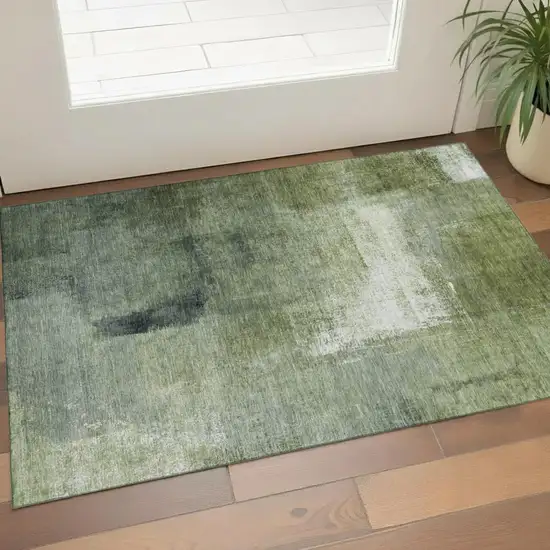 Green And Ivory Abstract Washable Area Rug With UV Protection Photo 1