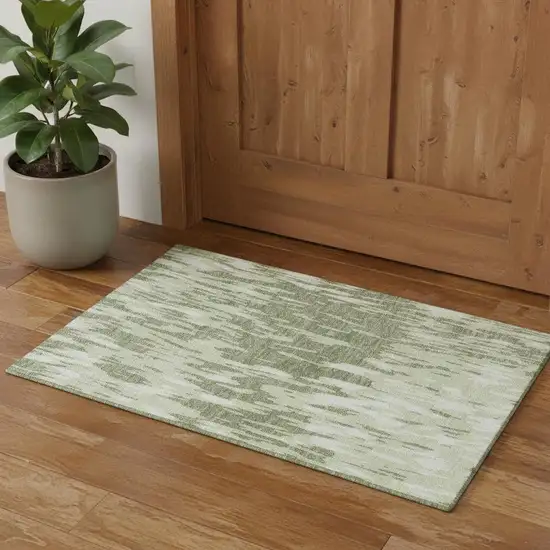 Green And Ivory Abstract Washable Area Rug With UV Protection Photo 1