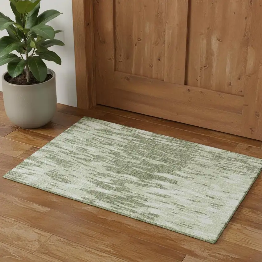 Green And Ivory Abstract Washable Area Rug With UV Protection Photo 1