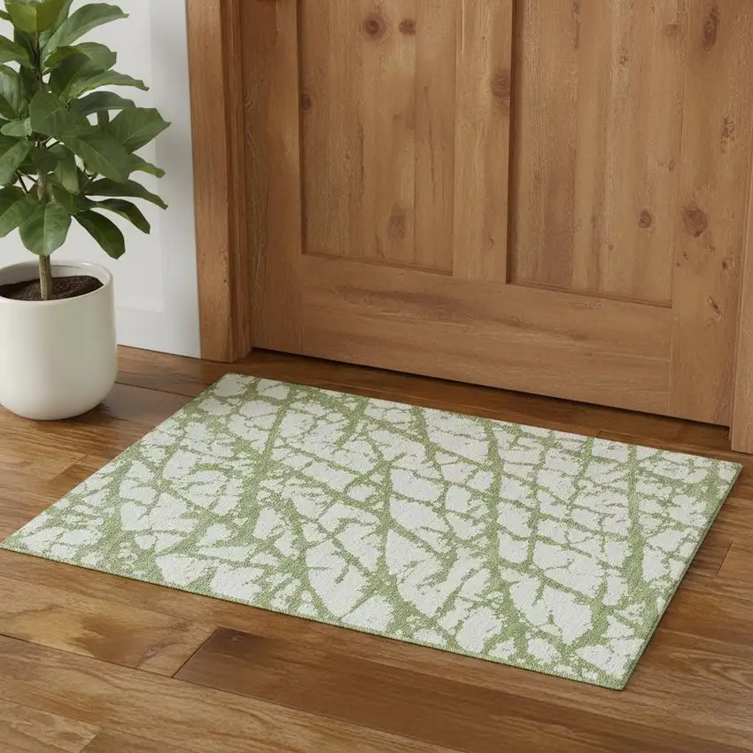 Green And Ivory Abstract Washable Area Rug With UV Protection Photo 1