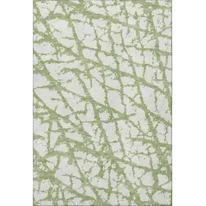 Photo of Green And Ivory Abstract Washable Area Rug With UV Protection