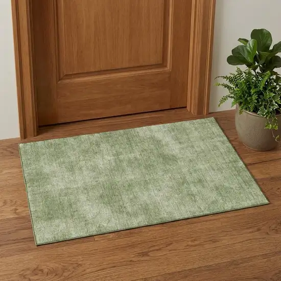 Green And Ivory Abstract Washable Area Rug With UV Protection Photo 1