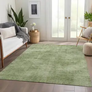 Photo of Green And Ivory Abstract Washable Area Rug With UV Protection
