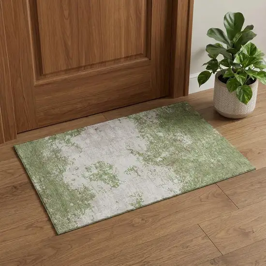 Green And Ivory Abstract Washable Area Rug With UV Protection Photo 1