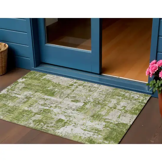 Green And Ivory Abstract Washable Indoor Outdoor Area Rug Photo 1