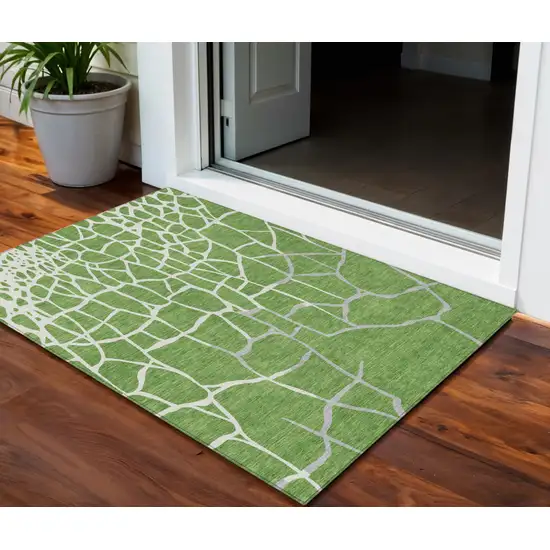 Green And Ivory Abstract Washable Indoor Outdoor Area Rug Photo 1
