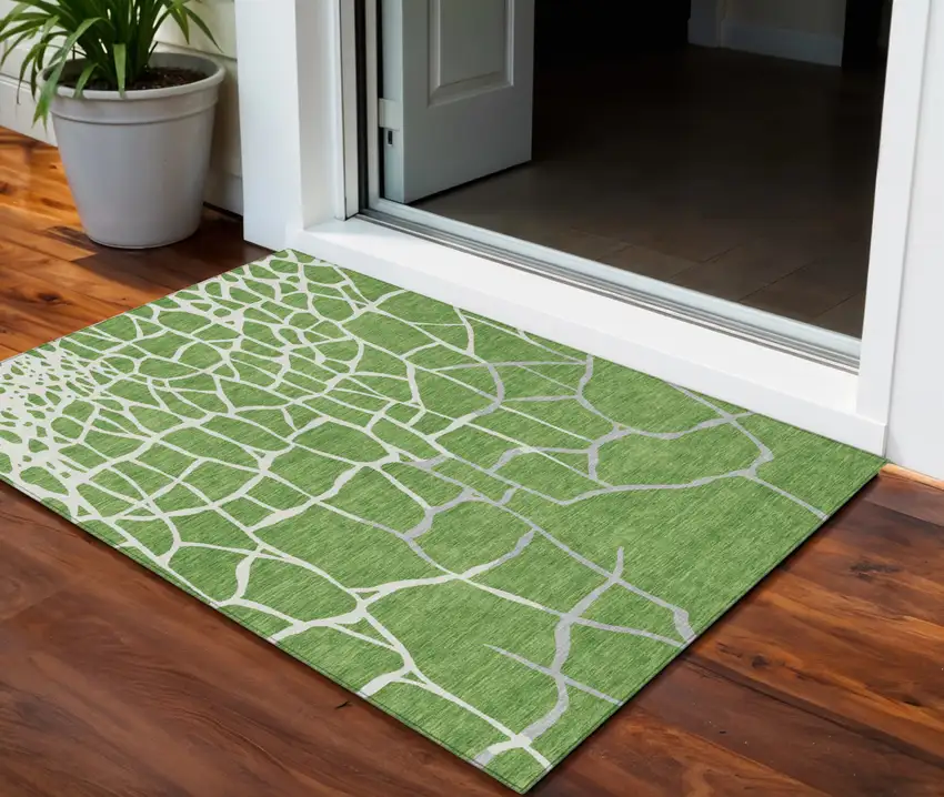Green And Ivory Abstract Washable Indoor Outdoor Area Rug Photo 1