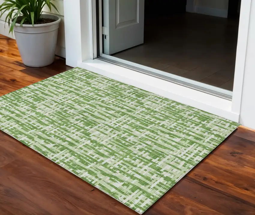 Green And Ivory Abstract Washable Indoor Outdoor Area Rug Photo 1