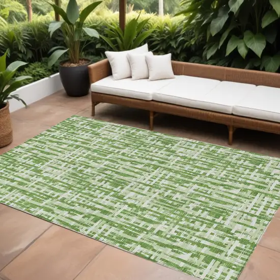 Green And Ivory Abstract Washable Indoor Outdoor Area Rug Photo 1