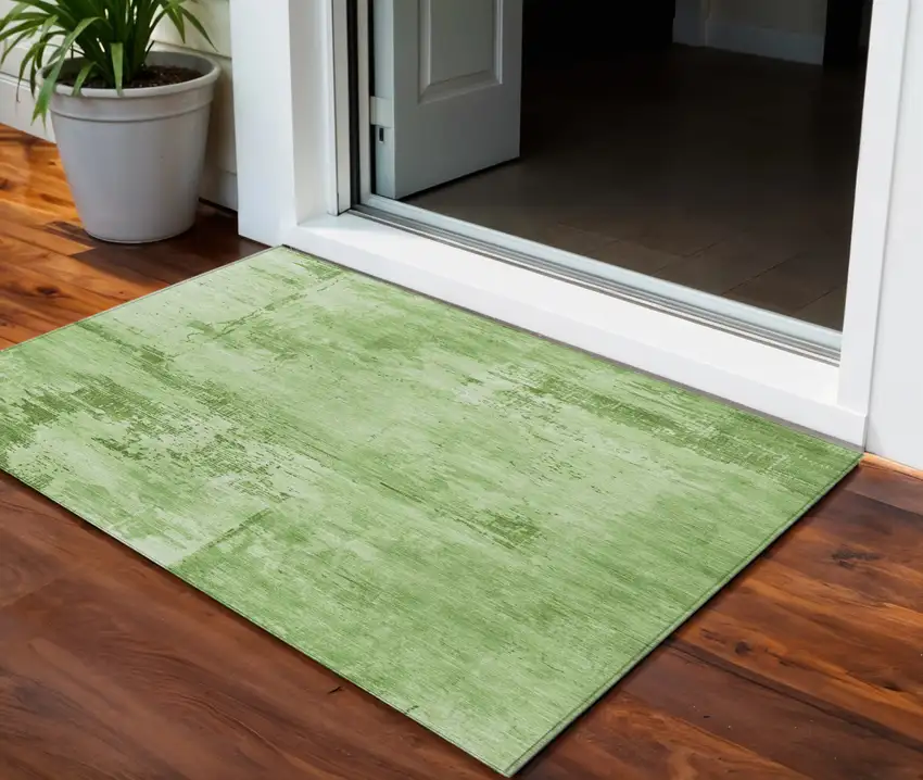 Green And Ivory Abstract Washable Indoor Outdoor Area Rug Photo 1