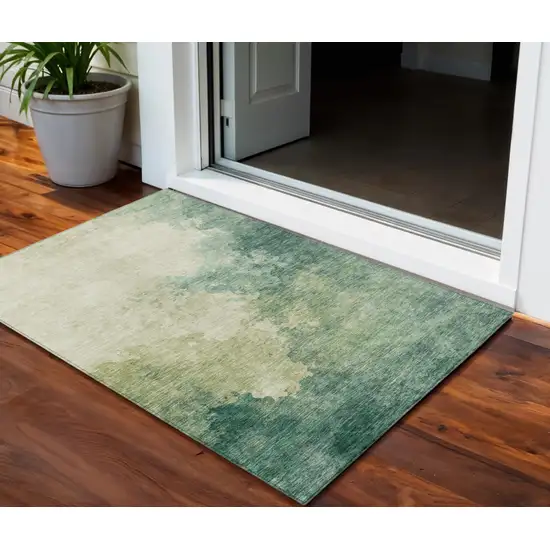 Green And Ivory Abstract Washable Indoor Outdoor Area Rug Photo 1