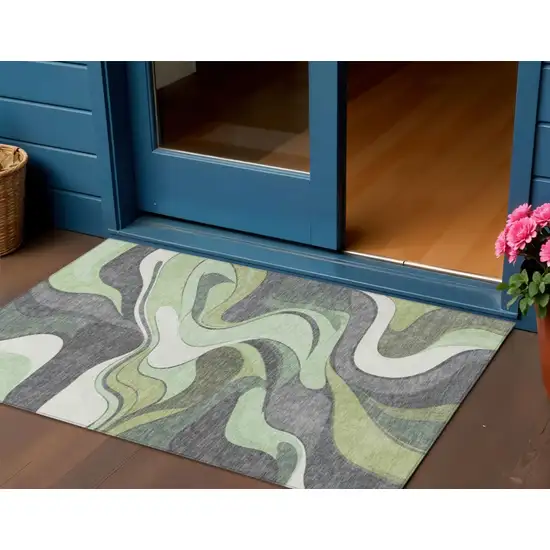 Green And Ivory Abstract Washable Indoor Outdoor Area Rug Photo 2