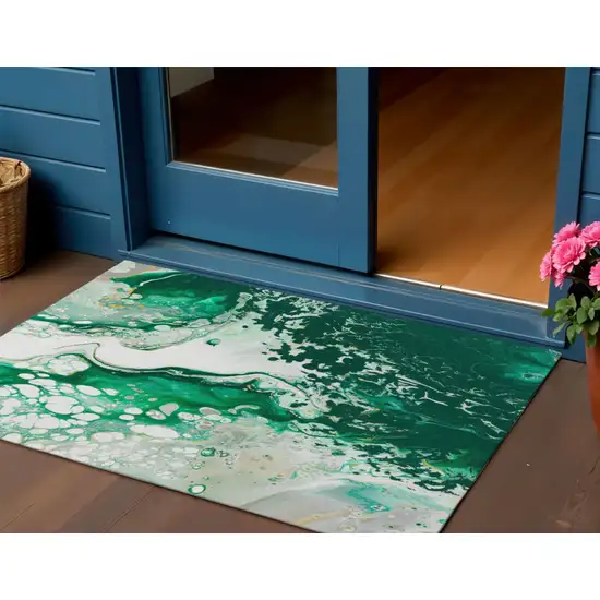 Green And Ivory Abstract Washable Indoor Outdoor Area Rug Photo 1