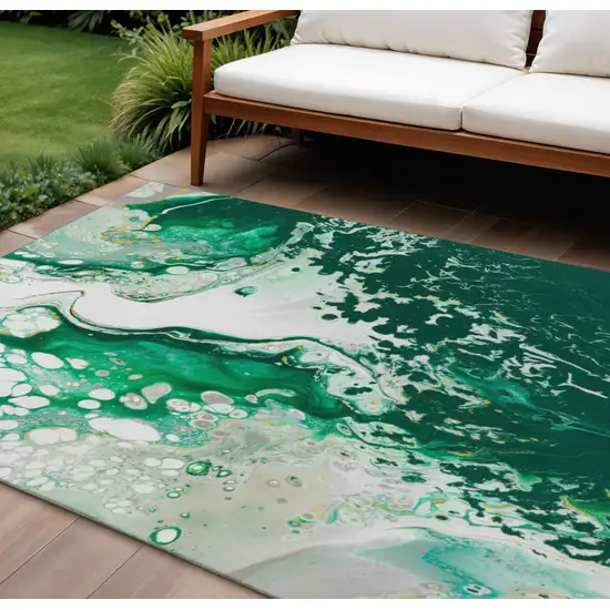 Green And Ivory Abstract Washable Indoor Outdoor Area Rug Photo 1