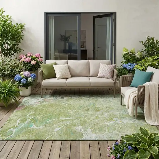 Green And Ivory Abstract Washable Indoor Outdoor Area Rug Photo 1