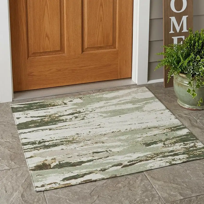 Green And Ivory Abstract Washable Indoor Outdoor Area Rug Photo 1