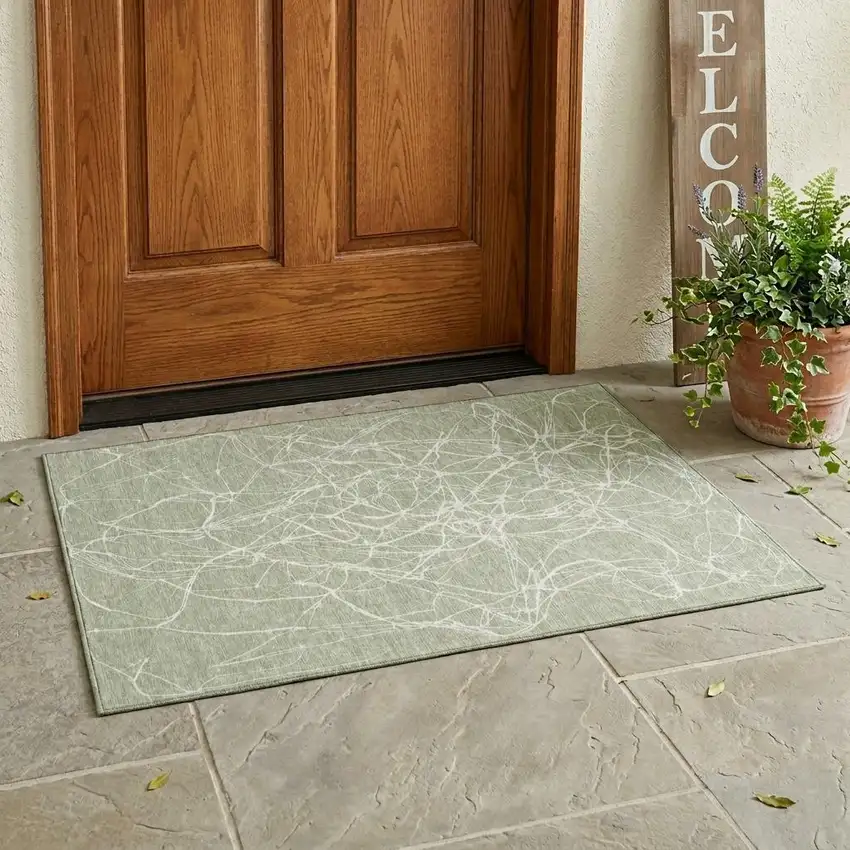 Green And Ivory Abstract Washable Indoor Outdoor Area Rug Photo 1