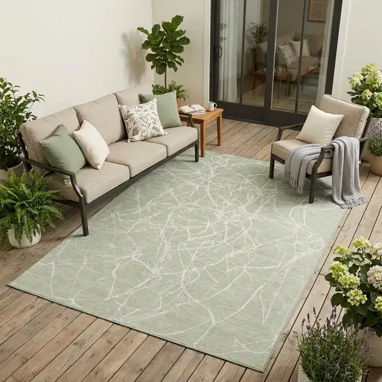 Green And Ivory Abstract Washable Indoor Outdoor Area Rug Photo 1