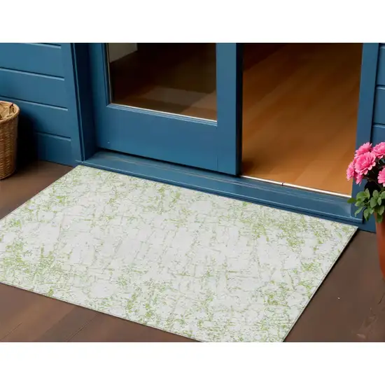 Green And Ivory Abstract Washable Indoor Outdoor Area Rug Photo 1