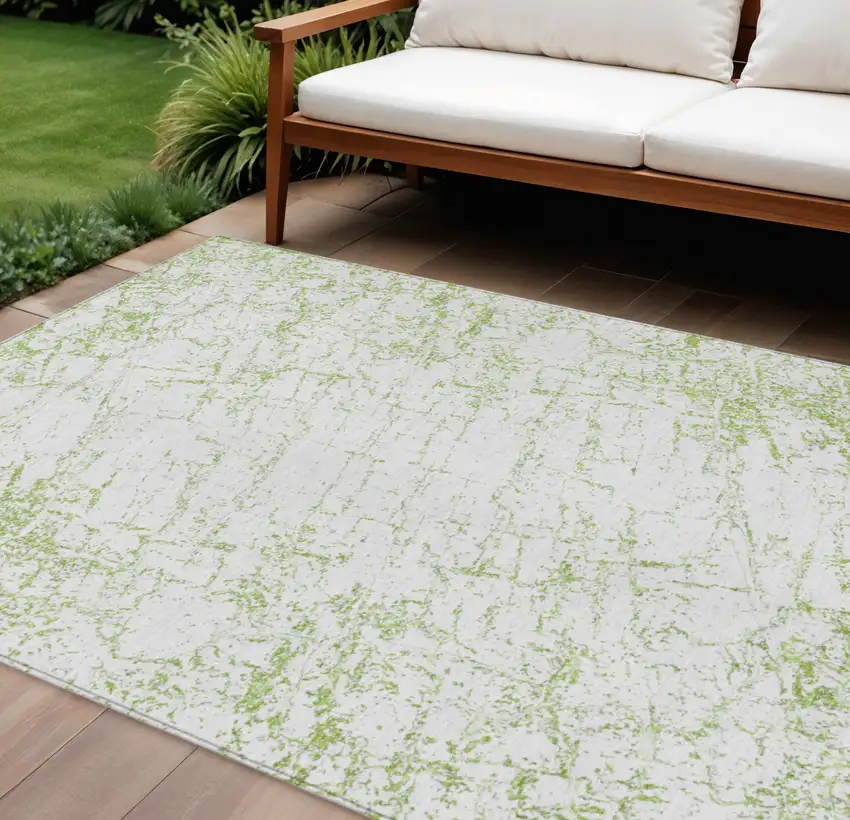 Green And Ivory Abstract Washable Indoor Outdoor Area Rug Photo 1