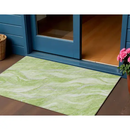 Green And Ivory Abstract Washable Indoor Outdoor Area Rug Photo 1