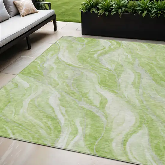 Green And Ivory Abstract Washable Indoor Outdoor Area Rug Photo 1