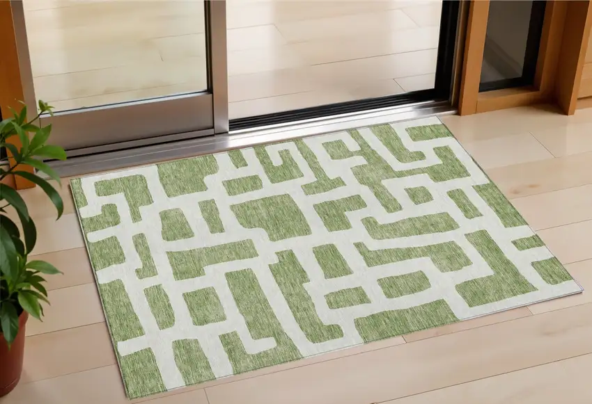Green And Ivory Abstract Washable Indoor Outdoor Area Rug Photo 1