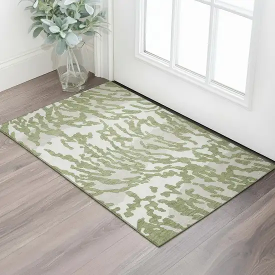 Green And Ivory Animal Print Washable Area Rug With UV Protection Photo 1