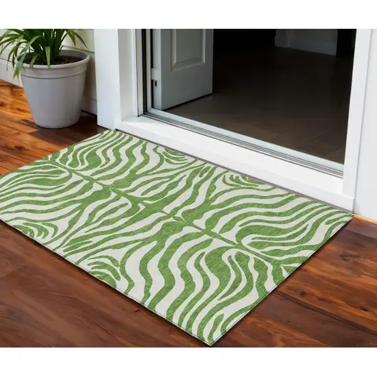 Green And Ivory Animal Print Washable Indoor Outdoor Area Rug Photo 1