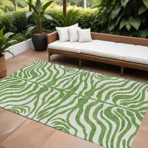 Photo of Green And Ivory Animal Print Washable Indoor Outdoor Area Rug