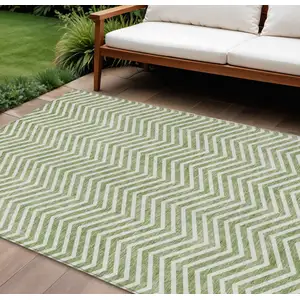 Photo of Green And Ivory Chevron Washable Indoor Outdoor Area Rug