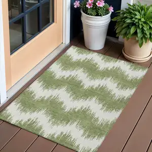 Photo of Green And Ivory Chevron Washable Indoor Outdoor Area Rug