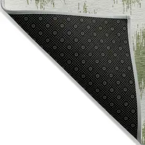 Photo of Green And Ivory Chevron Washable Indoor Outdoor Area Rug