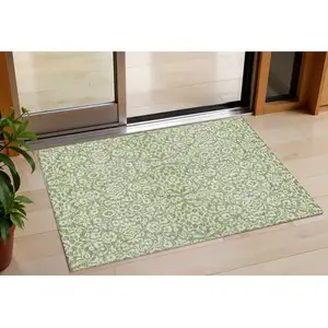 Photo of Green And Ivory Damask Washable Indoor Outdoor Area Rug