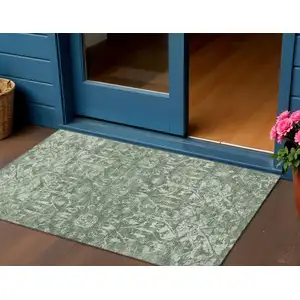 Photo of Green And Ivory Damask Washable Indoor Outdoor Area Rug