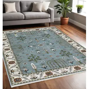 Photo of Green And Ivory Floral Area Rug With Fringe