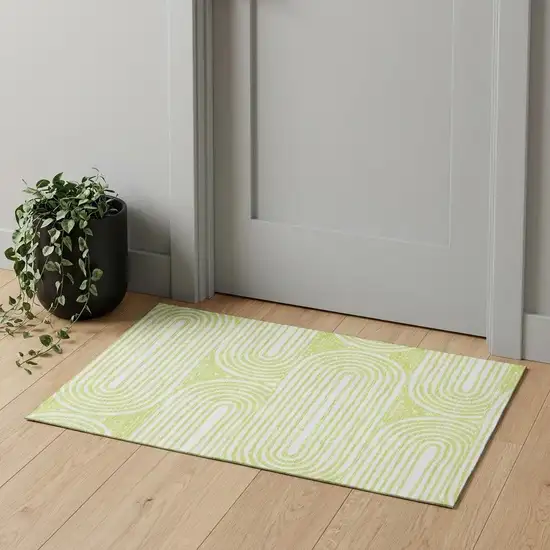 Green And Ivory Geometric Distressed Washable Area Rug With UV Protection Photo 1