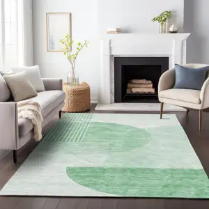 Photo of Green And Ivory Geometric Washable Area Rug With UV Protection